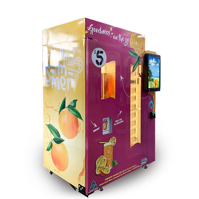 La máquina expendedora comercial del zumo de naranja del centro comercial acuña y observa aceptadores